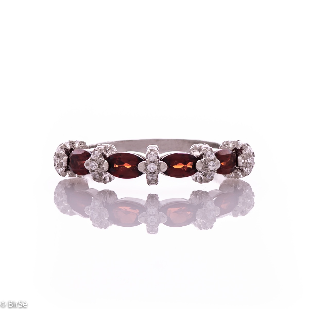 Delicate women's ring intertwining radiant natural garnet with sparkling zircons and exquisite workmanship entirely of rhodium-plated silver.