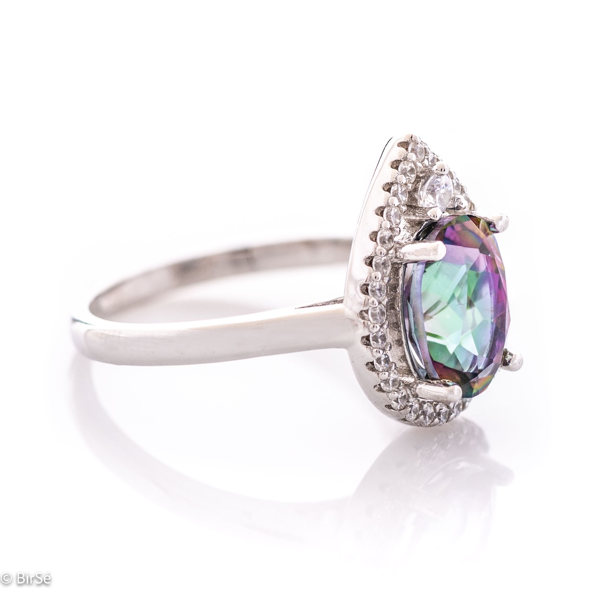 A spectacular and elegant ring interweaving multi-colored mystic topaz with a shell of sparkling zircons and beautiful craftsmanship entirely in rhodium-plated silver.