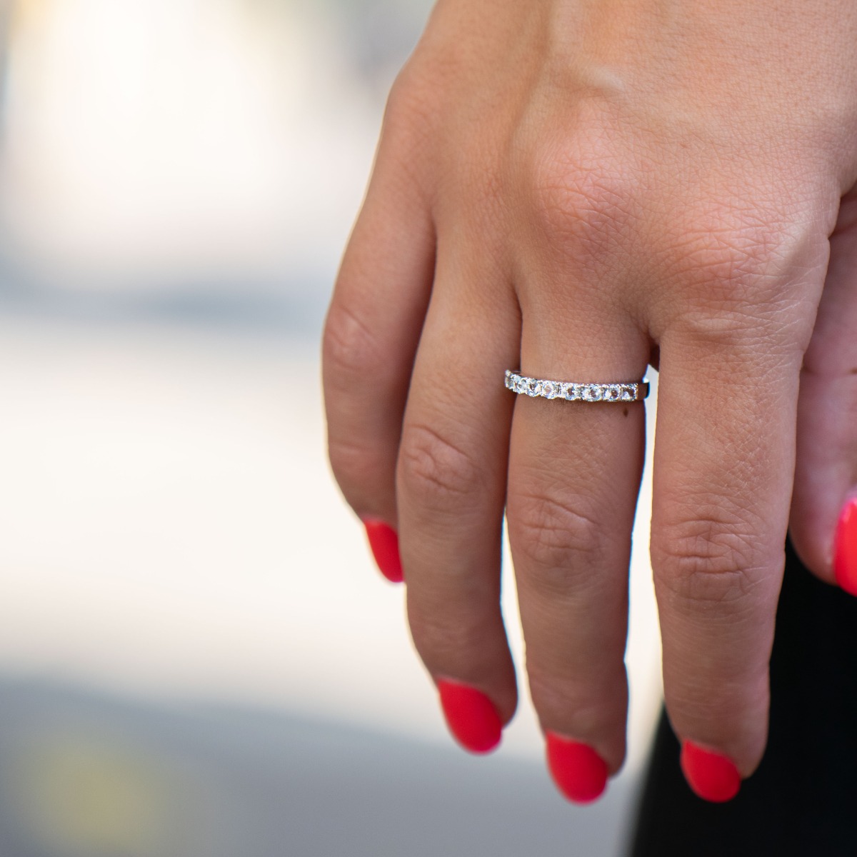 A dazzling ring of beautiful rhodium-plated sterling silver and a row of lovely sky blue topazes.