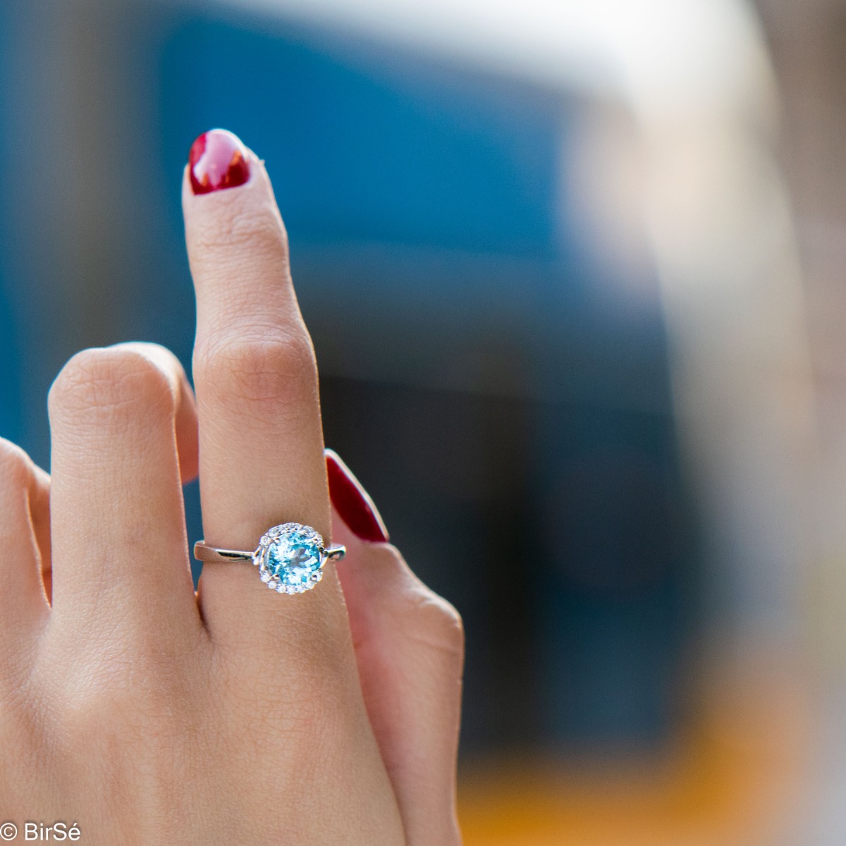 Finely crafted sterling silver ring with masterly detailing and a tempting combination of dazzling blue topaz and delicate zircons. Can be combined with earrings and pendant to the set.