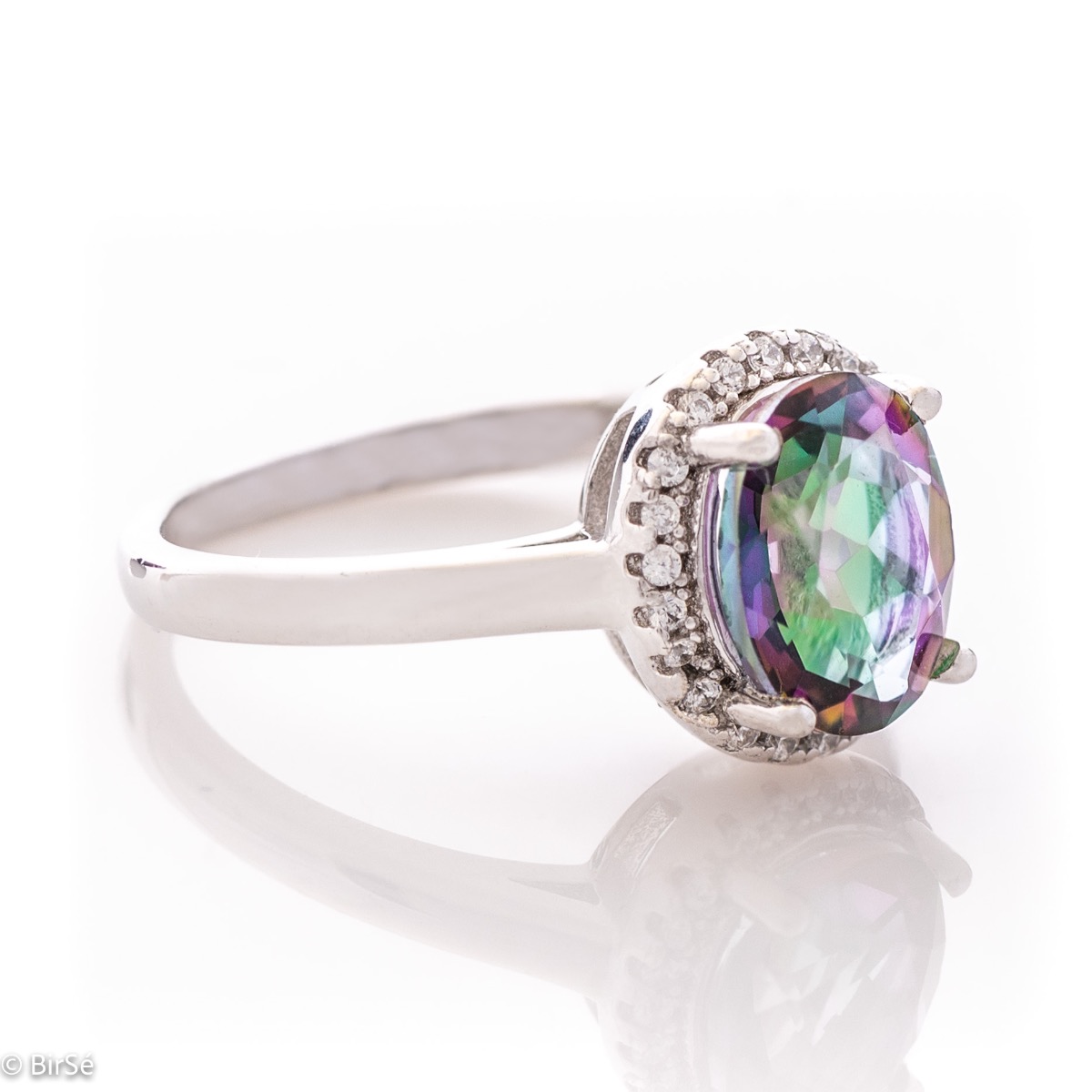 Exquisitely crafted entirely from soft rhodium silver with a stylish and simple design, combining a radiant natural mystic topaz surrounded by sparkling zircons - our new exclusive ladies' ring.