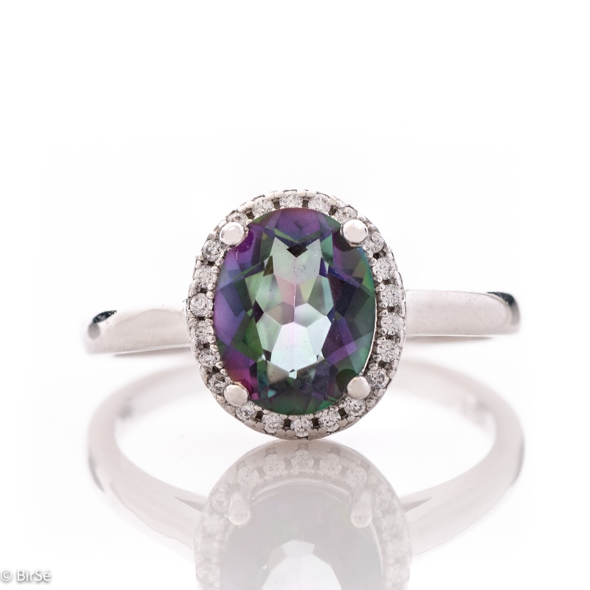 Exquisitely crafted entirely from soft rhodium silver with a stylish and simple design, combining a radiant natural mystic topaz surrounded by sparkling zircons - our new exclusive ladies' ring.