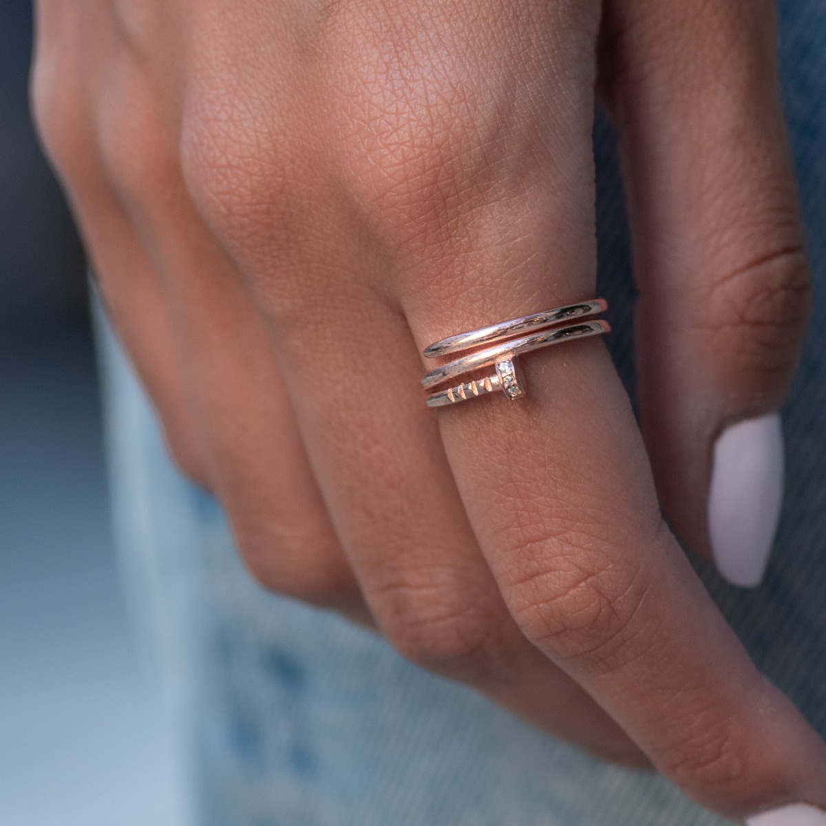 Tempting with its modern style and look, this silver stud ring is a sought after and preferred piece of jewelry by many young girls or stylish ladies. The softness of rose silver is just another plus for the jewelry.