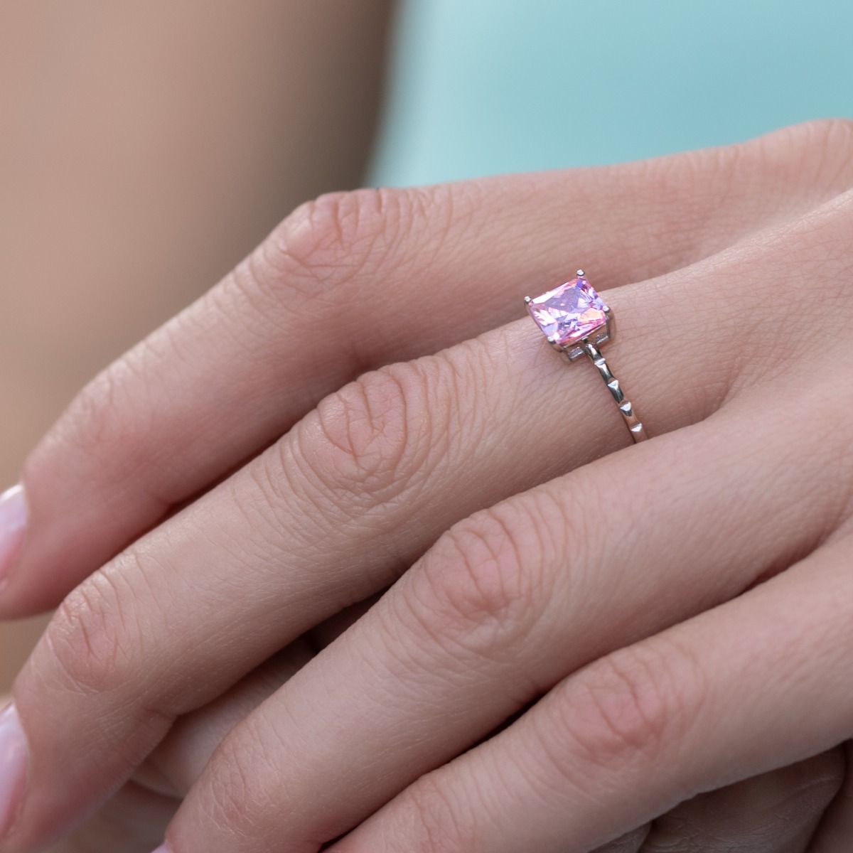 Delicately elegant women's ring with exquisite pink zircon. Stylish layout of the details and shapes from fine rhodium silver.