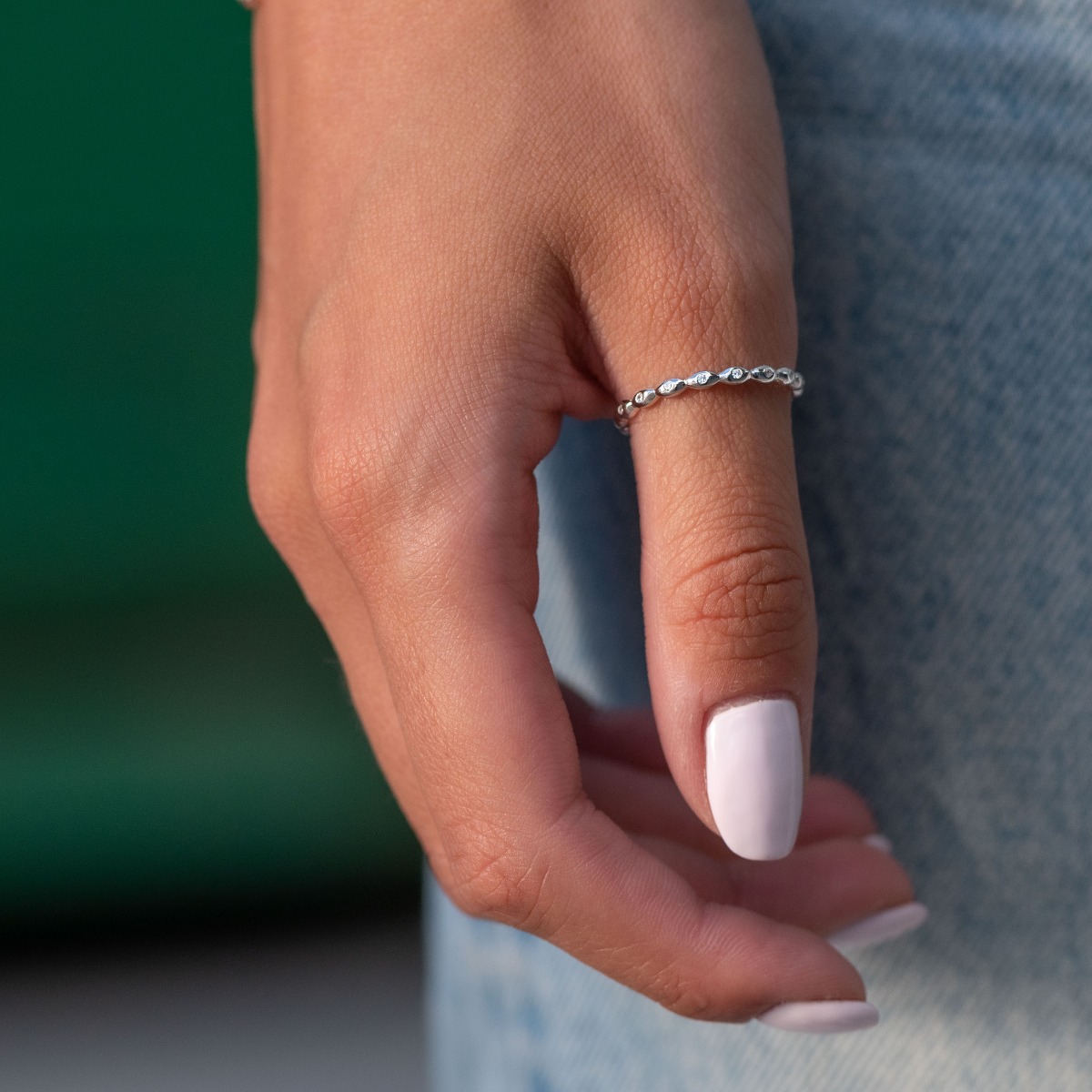 Silver ring with delicate rhodium-plated silver curves. Sparkling zircons bring a fresh breath of ethereal elegance.