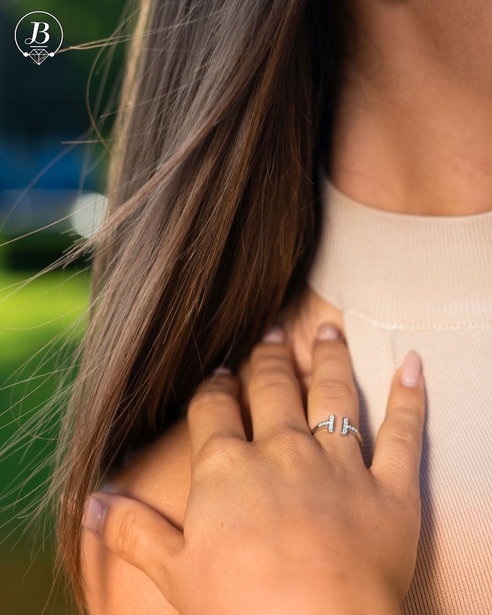 An elegant women's ring with precise Tiffany-style craftsmanship, combining delicate rhodium-plated silver with fine, sparkling zircons.