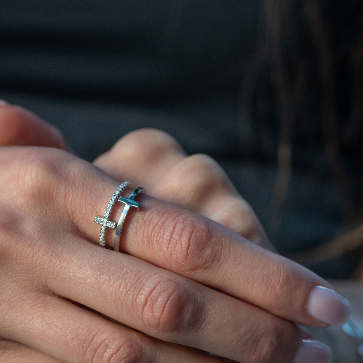 A spectacular double ring with a modern design and exquisite workmanship combining delicate rhodium silver with fine sparkling zircons.