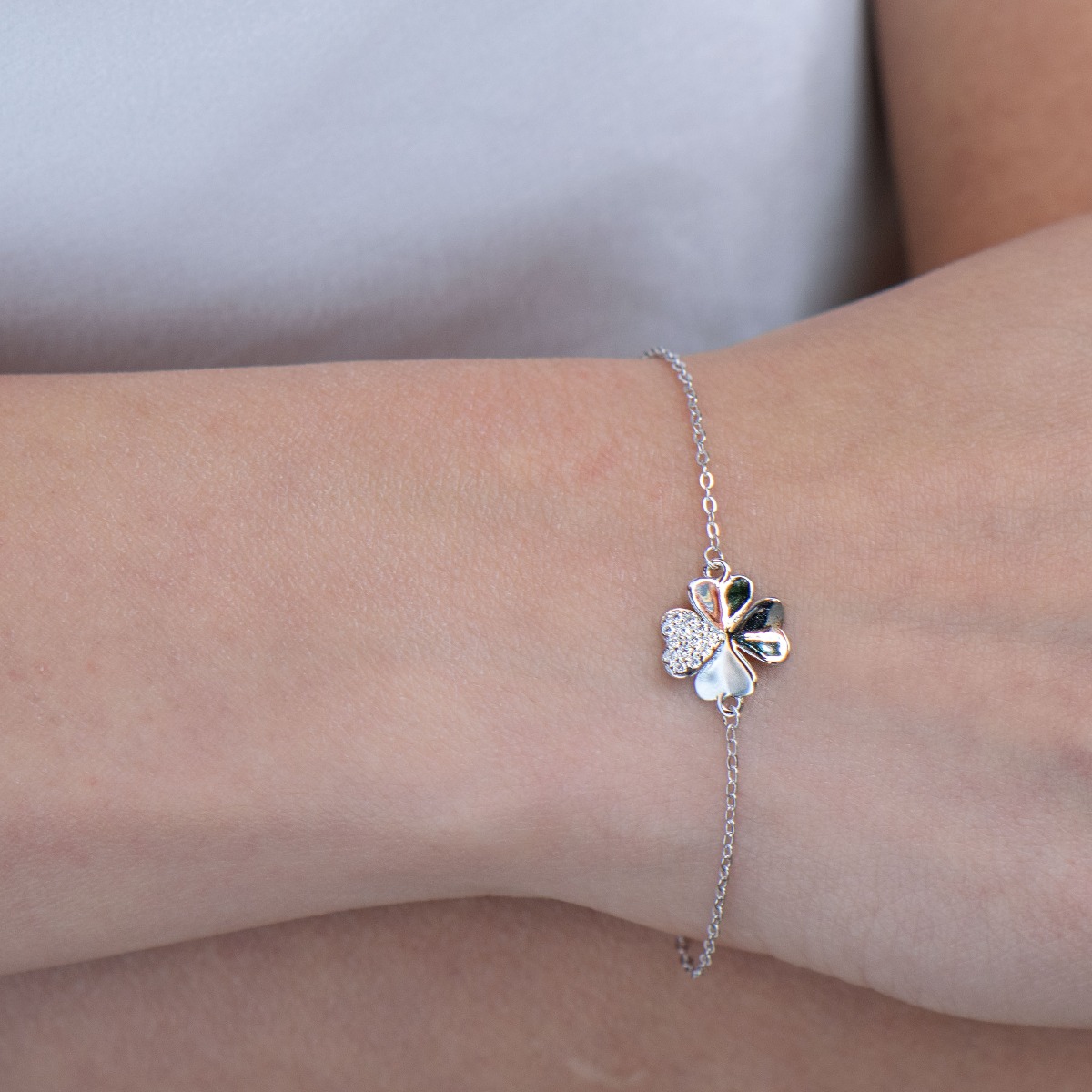 Stylish women's bracelet in rhodium-plated silver with a dainty lucky clover. The delicate women's bracelet with sparkling zircons is a great proposal from BirSe for a gift to the beloved woman.