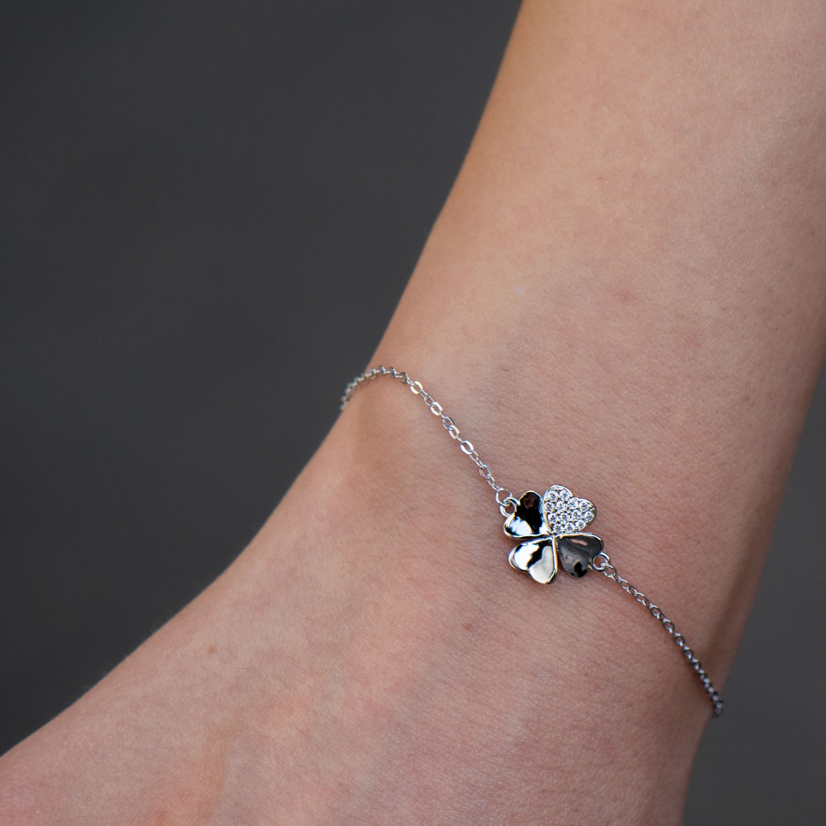 Stylish women's bracelet in rhodium-plated silver with a dainty lucky clover. The delicate women's bracelet with sparkling zircons is a great proposal from BirSe for a gift to the beloved woman.