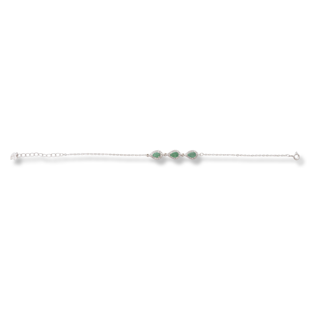 Elegant women's bracelet in soft silver with natural emerald drops, decorated with exquisite and subtle elements and sparkling zircons. The bracelet has an extension, for greater convenience when adjusting the length.