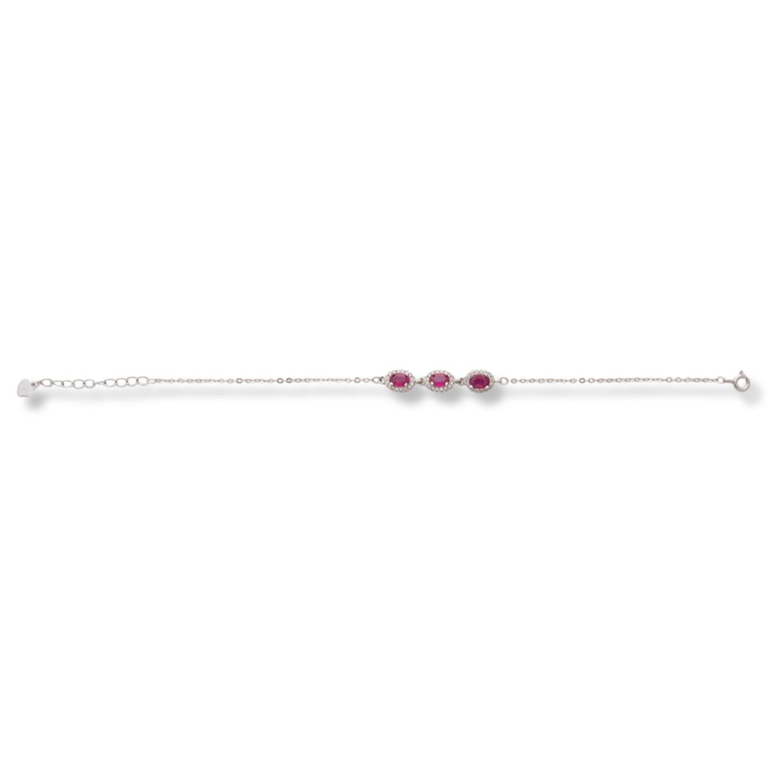 Elegant women's bracelet made of soft silver with natural ruby ​​stones, decorated with exquisite and subtle elements and sparkling zircons. The bracelet has an extension, for greater convenience when adjusting the length.