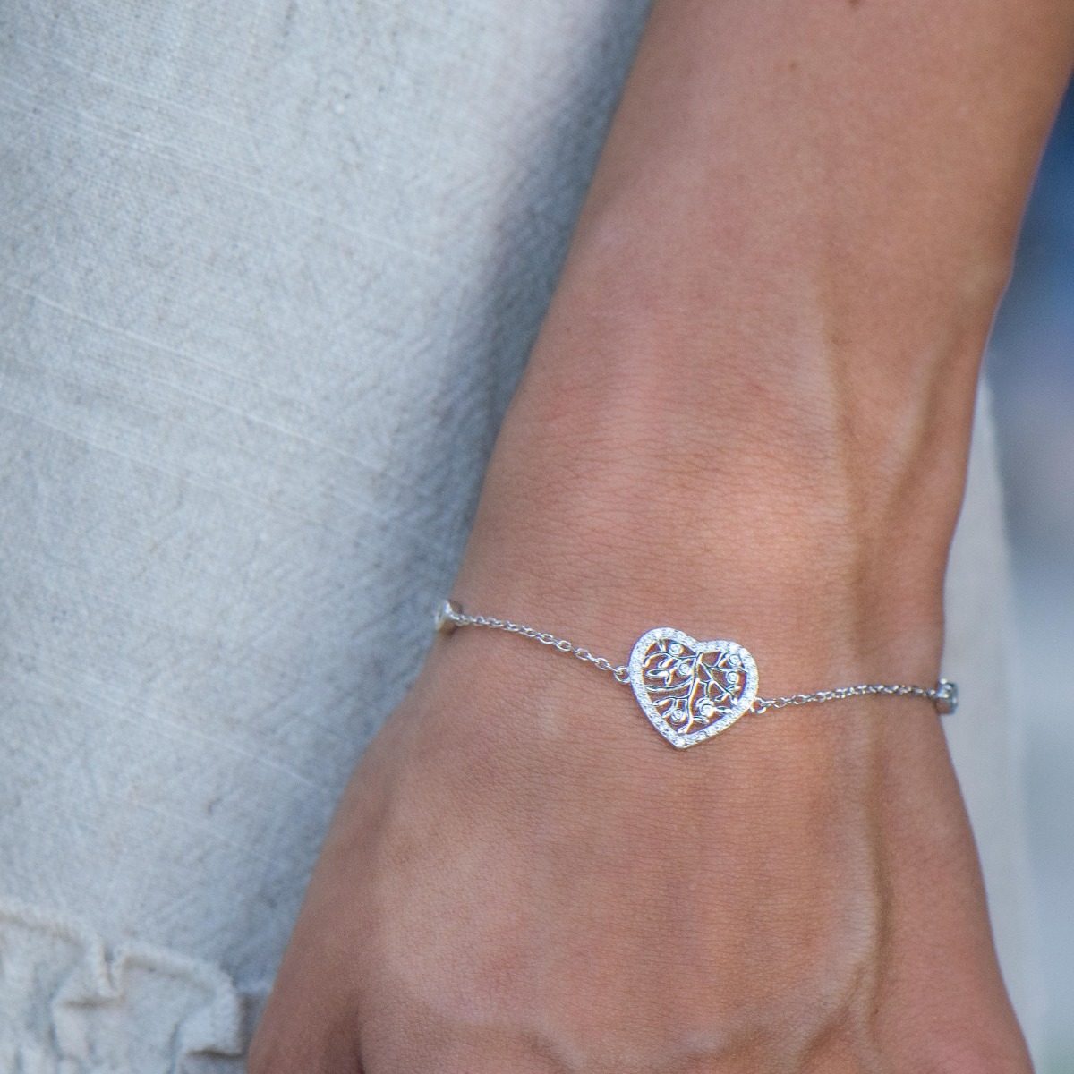 Ethereal women's jewelry made of soft silver with exquisite workmanship. The fine women's bracelet is a combination of the tree of life, elegantly crafted in a heart of zircons. The bracelet has an extension, for more convenience when adjusting the length