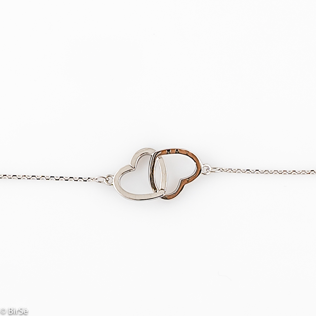 An elegant women's bracelet with delicate workmanship entirely of shiny rhodium-plated silver and two beautiful, intertwined hearts. Stylish and clean composition of details and adjustable size, suitable for all ladies.