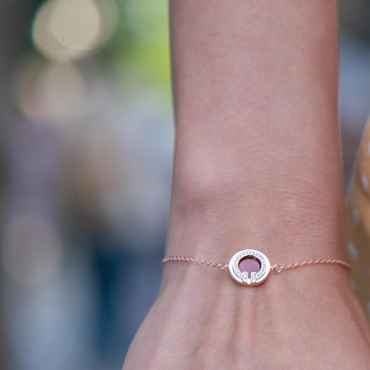 A delicately charming bracelet for stylish ladies, made entirely of beautiful rose silver, with a feature embellished with sparkling zircons and red enamel. An additional link on the chain makes it possible to adjust the size of the jewelry.