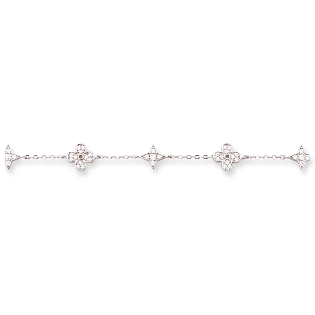 Stylish women's bracelet with adjustable size and delicate craftsmanship, combining refined rhodium-plated silver with delicate flower elements, complemented by sparkling zircons.