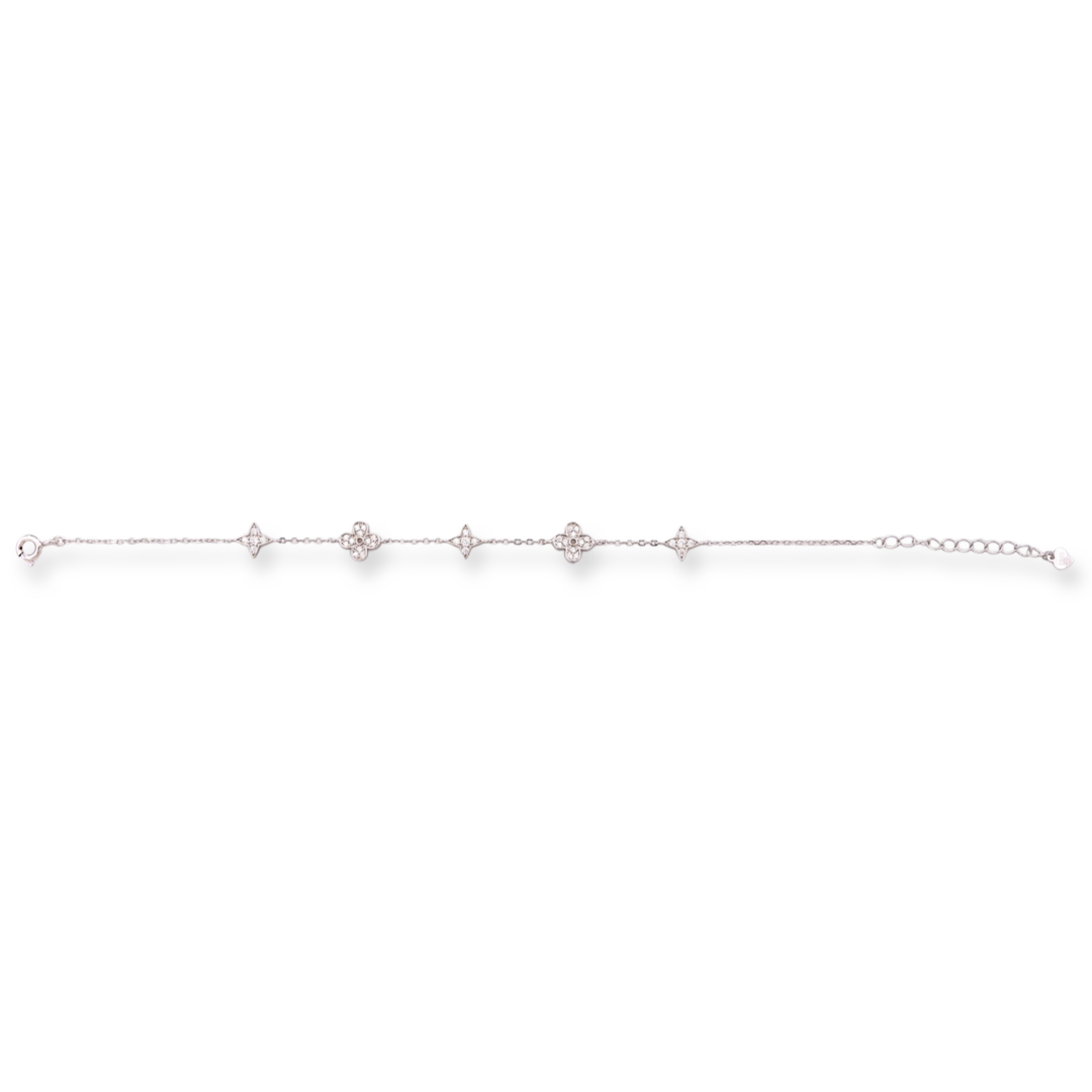 Stylish women's bracelet with adjustable size and delicate craftsmanship, combining refined rhodium-plated silver with delicate flower elements, complemented by sparkling zircons.