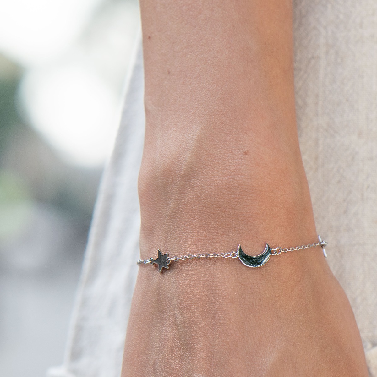 Exquisitely crafted women's bracelet, with elegantly shaped rhodium-plated silver moons and stars. Present the moon and stars to your beloved and see the pleasure in her eyes. A suitable gift for any occasion.