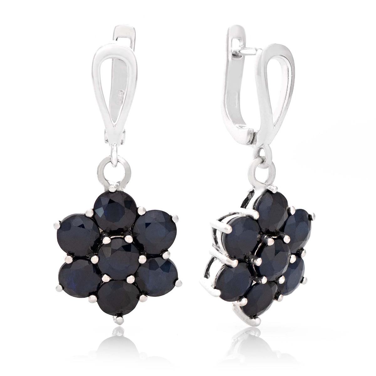 Exquisitely crafted earrings of beautiful rhodium silver and magnetic natural sapphire arranged in a flower shape. Our new English clasp earrings are part of a charming ring and pendant set.