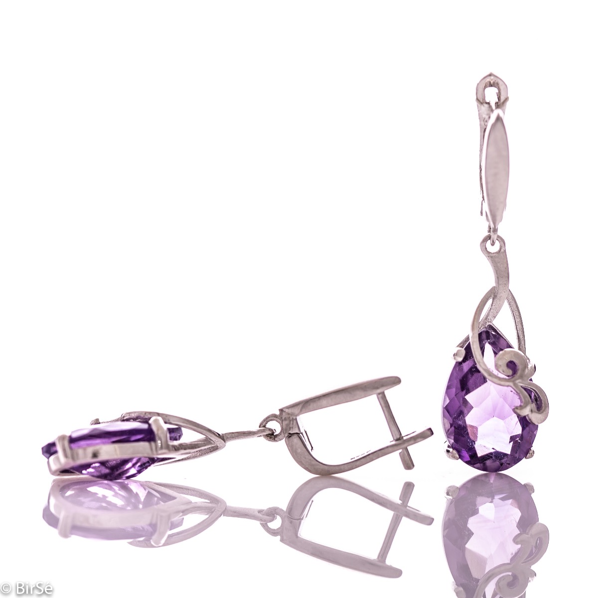 Exclusive pendant earrings with English clasp and exquisite workmanship combining radiant natural amethyst in a delicate teardrop shape with shiny rhodium silver. Can be combined with pendant and ring of the same model.