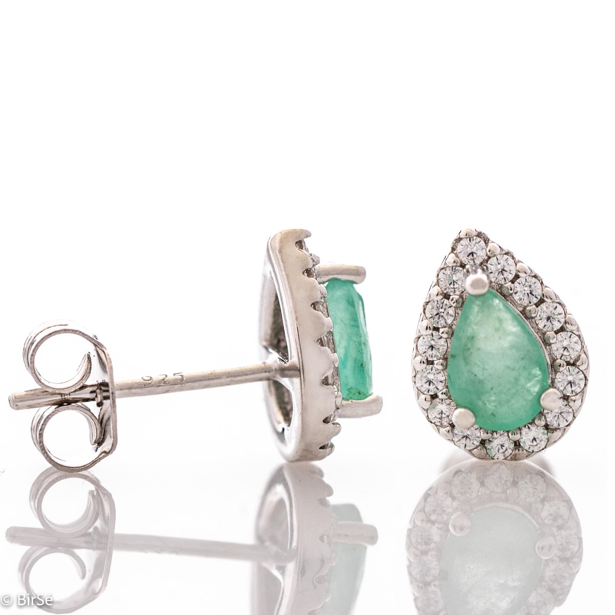 Radiant stud earrings delicately crafted in teardrop shape and fine rhodium silver, complemented by exquisite natural emerald and sparkling zircons.