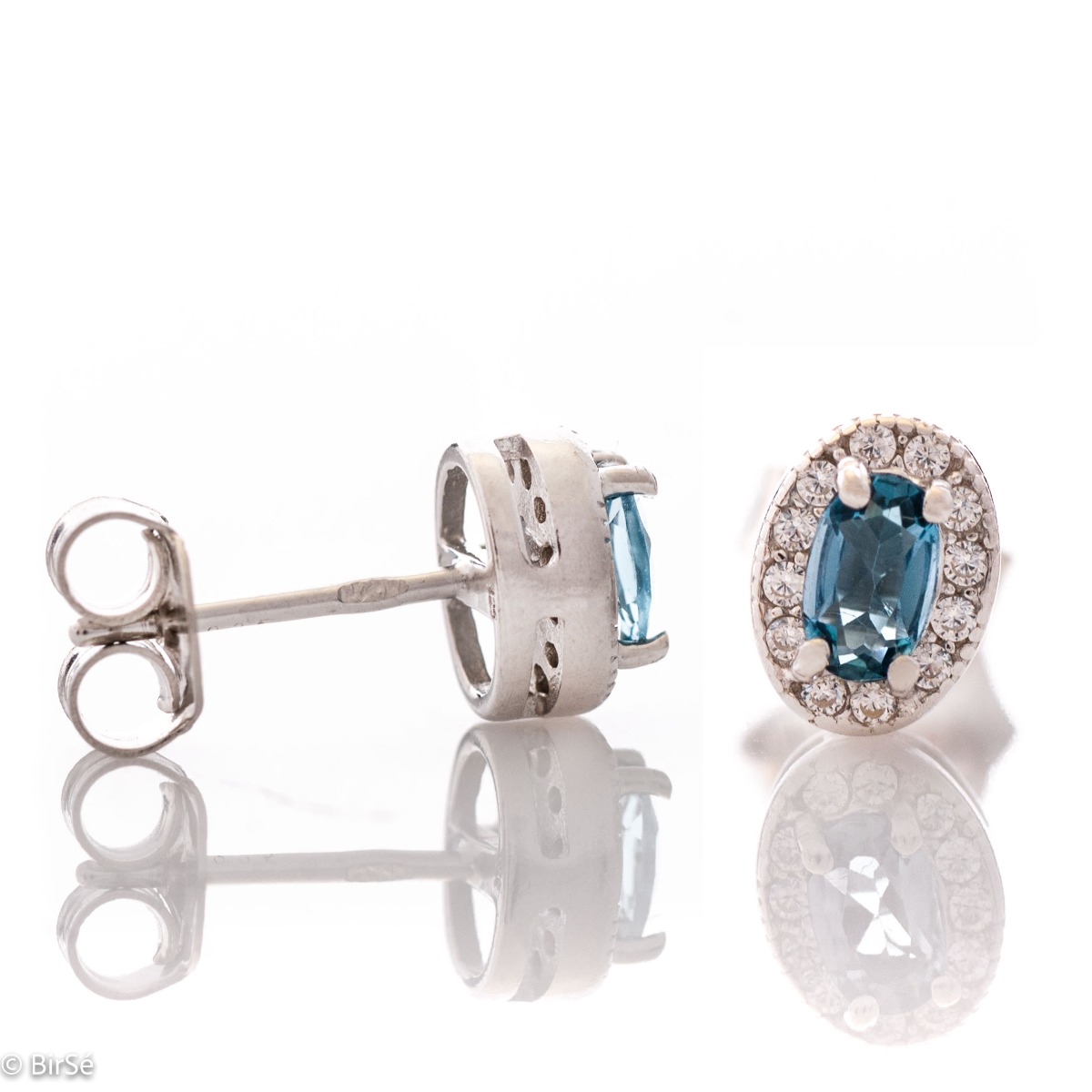 Royal vision - stunning silver earrings with a spectacular look and stud fastening. An elegant composition made of a fine combination of rhodium-plated silver with exquisite London topaz and zircons.