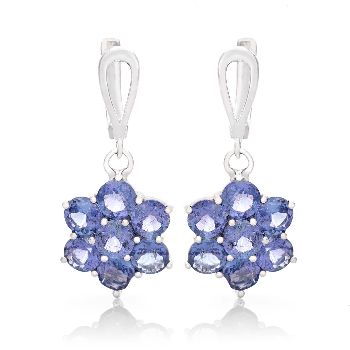 Captivating earrings crafted from beautiful rhodium silver and radiant natural tanzanite arranged in a flower shape. Our new English clasp earrings are part of a charming ring and pendant set.