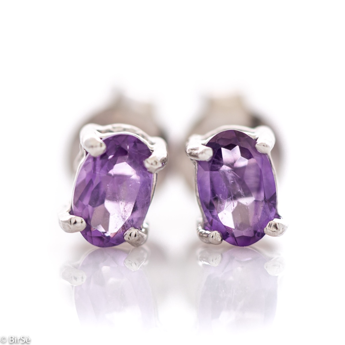 The gentle glow of a beautiful natural amethyst stone combined with fine craftsmanship in all rhodium silver, in our new women's stud earrings.