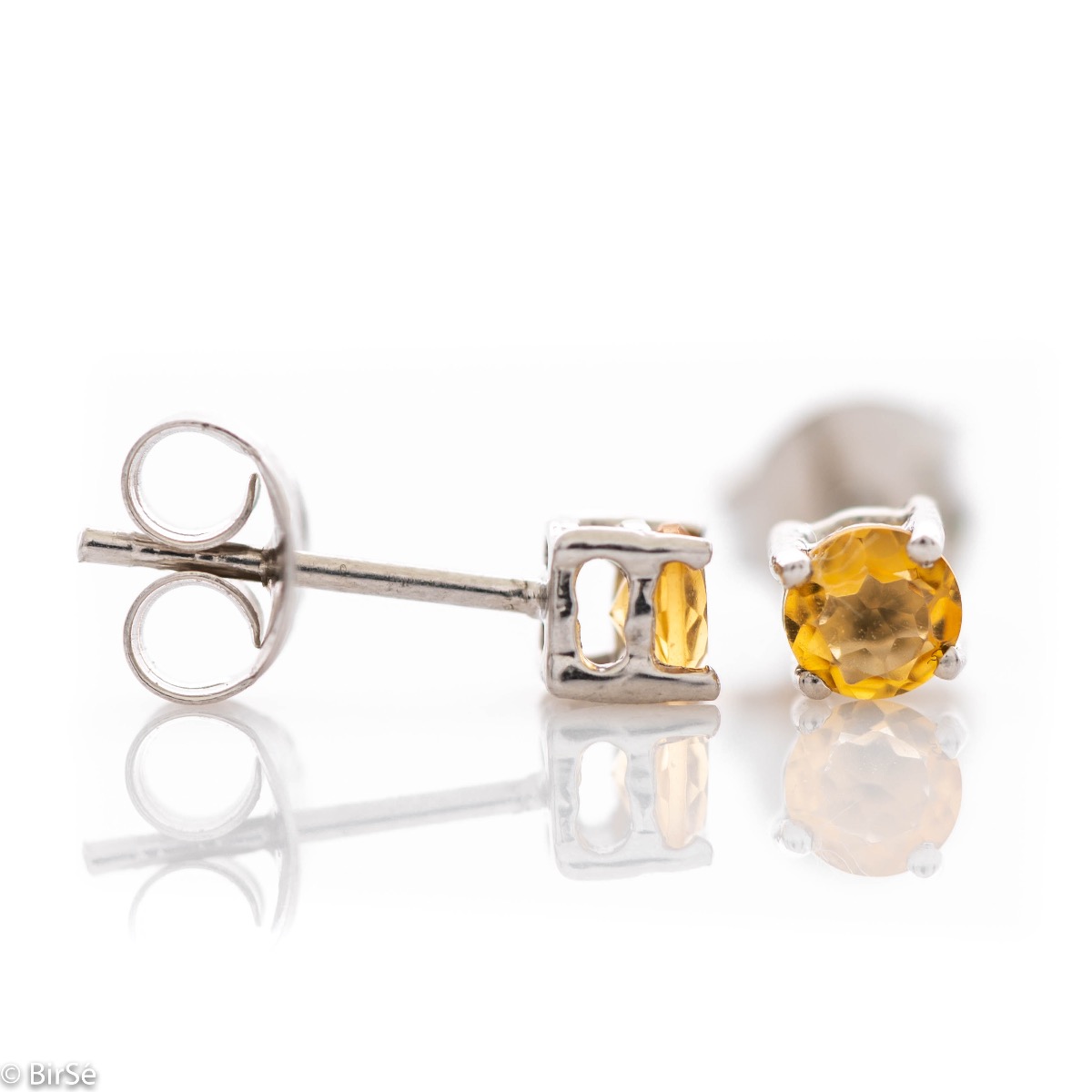 Delicate stud earrings with precision craftsmanship in beautiful rhodium silver, complemented by a fine and radiant natural citrine stone. Also suitable for children.