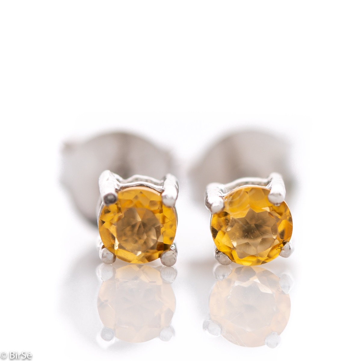 Delicate stud earrings with precision craftsmanship in beautiful rhodium silver, complemented by a fine and radiant natural citrine stone. Also suitable for children.