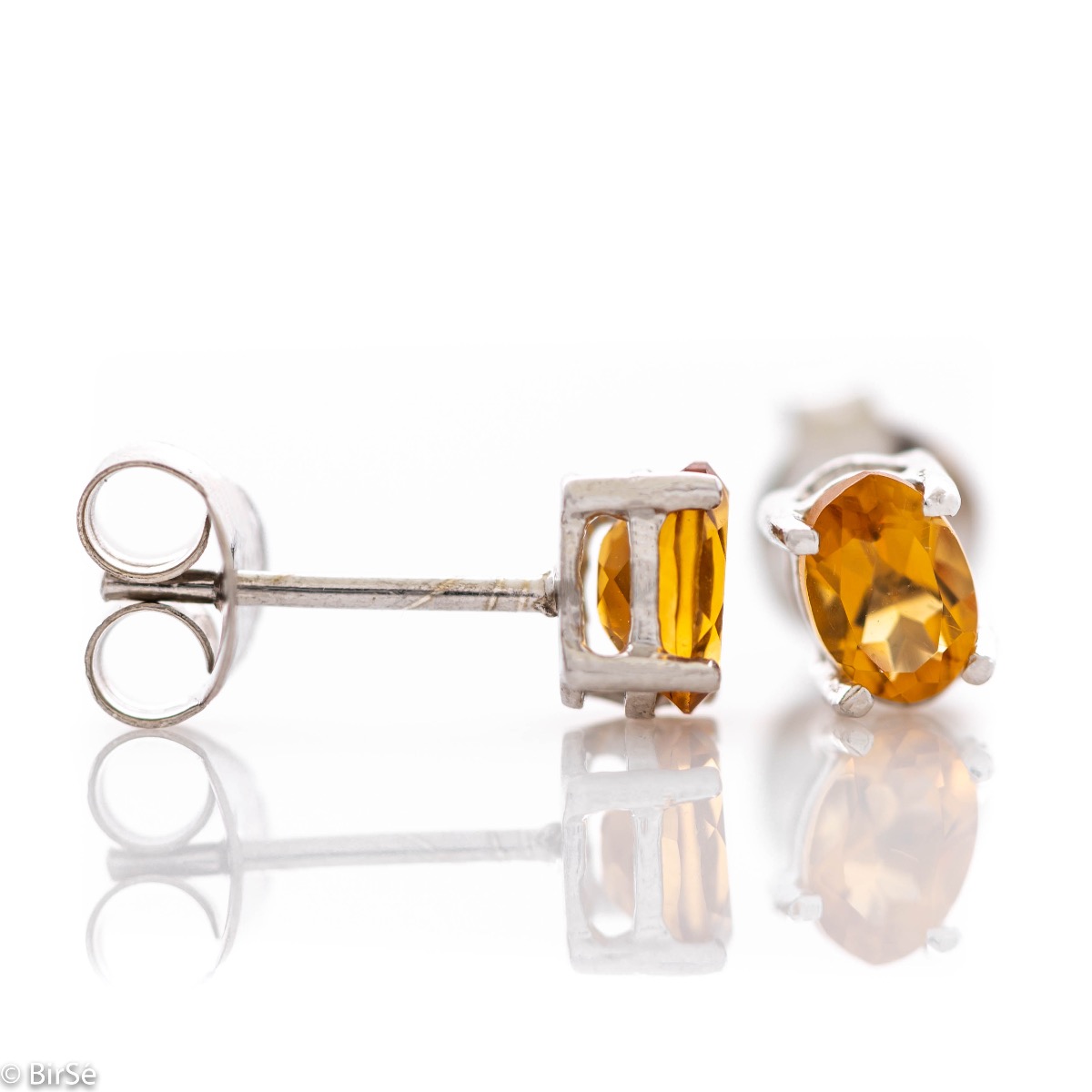 The gentle glow of a beautiful natural citrine stone combined with fine craftsmanship in all rhodium silver, in our new women's stud earrings.