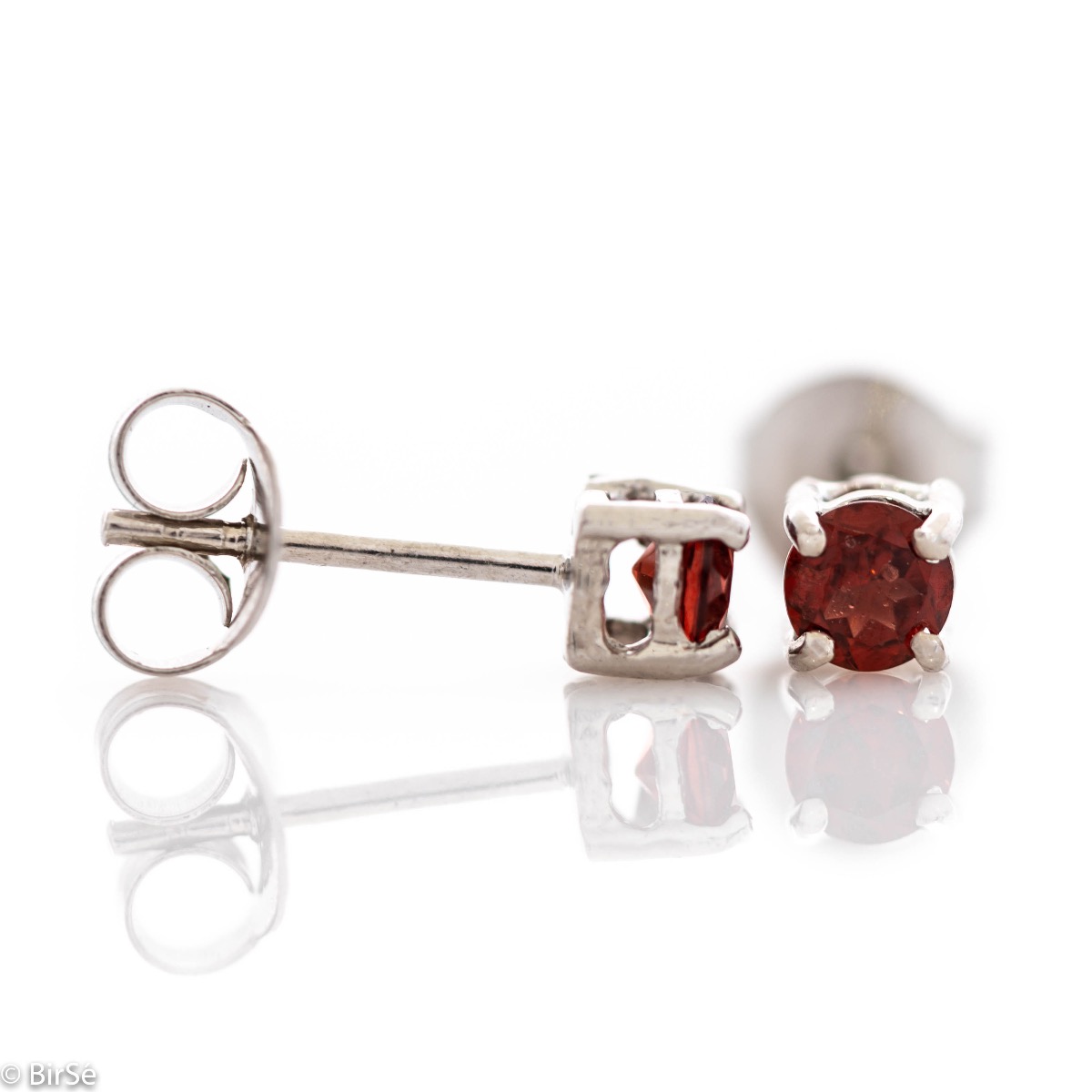 Fine stud earrings with the gentle glow of natural garnet and beautifully crafted entirely in rhodium-plated silver. Light weight, suitable for both ladies and children.