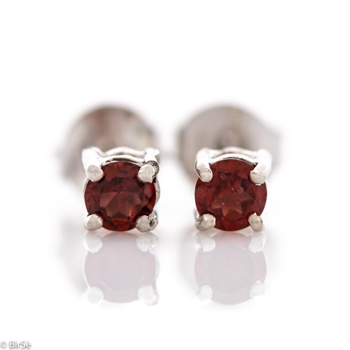 Fine stud earrings with the gentle glow of natural garnet and beautifully crafted entirely in rhodium-plated silver. Light weight, suitable for both ladies and children.