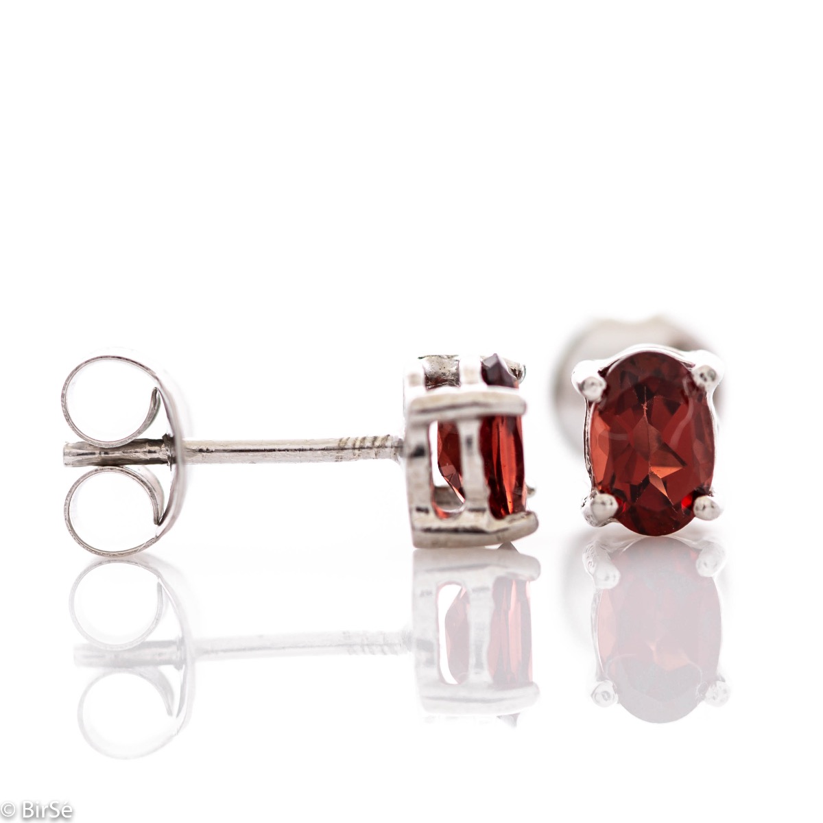 The gentle glow of a beautiful natural garnet stone combined with fine craftsmanship in all rhodium silver, in our new women's stud earrings.