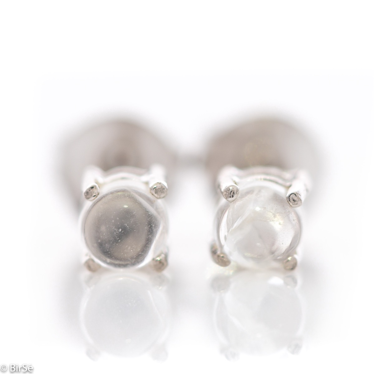 Delicate and delicate stud earrings suitable for both ladies and children, finely crafted from beautifully rhodium-plated sterling silver, complemented by a radiant natural moonstone.