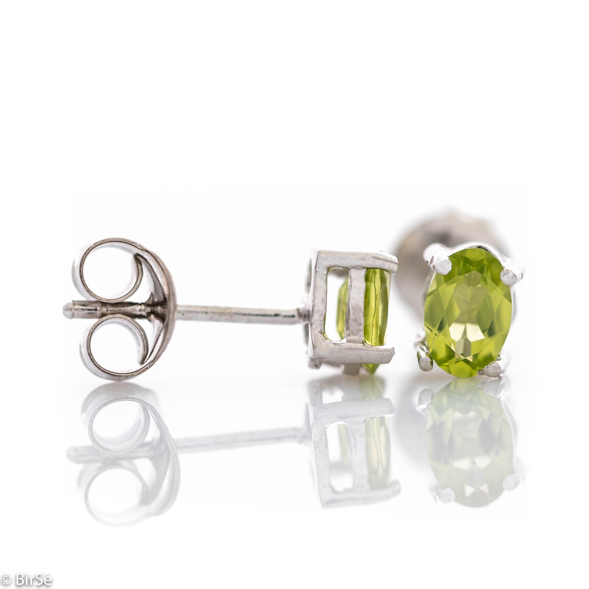 The gentle glow of a beautiful natural peridot stone combined with fine craftsmanship in all rhodium silver, in our new women's stud earrings.