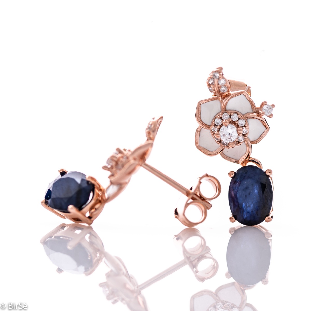 Elegant and beautiful women's earrings made of rhodium-plated rose silver, complemented by radiant natural sapphires and flowers with sparkling zircons.