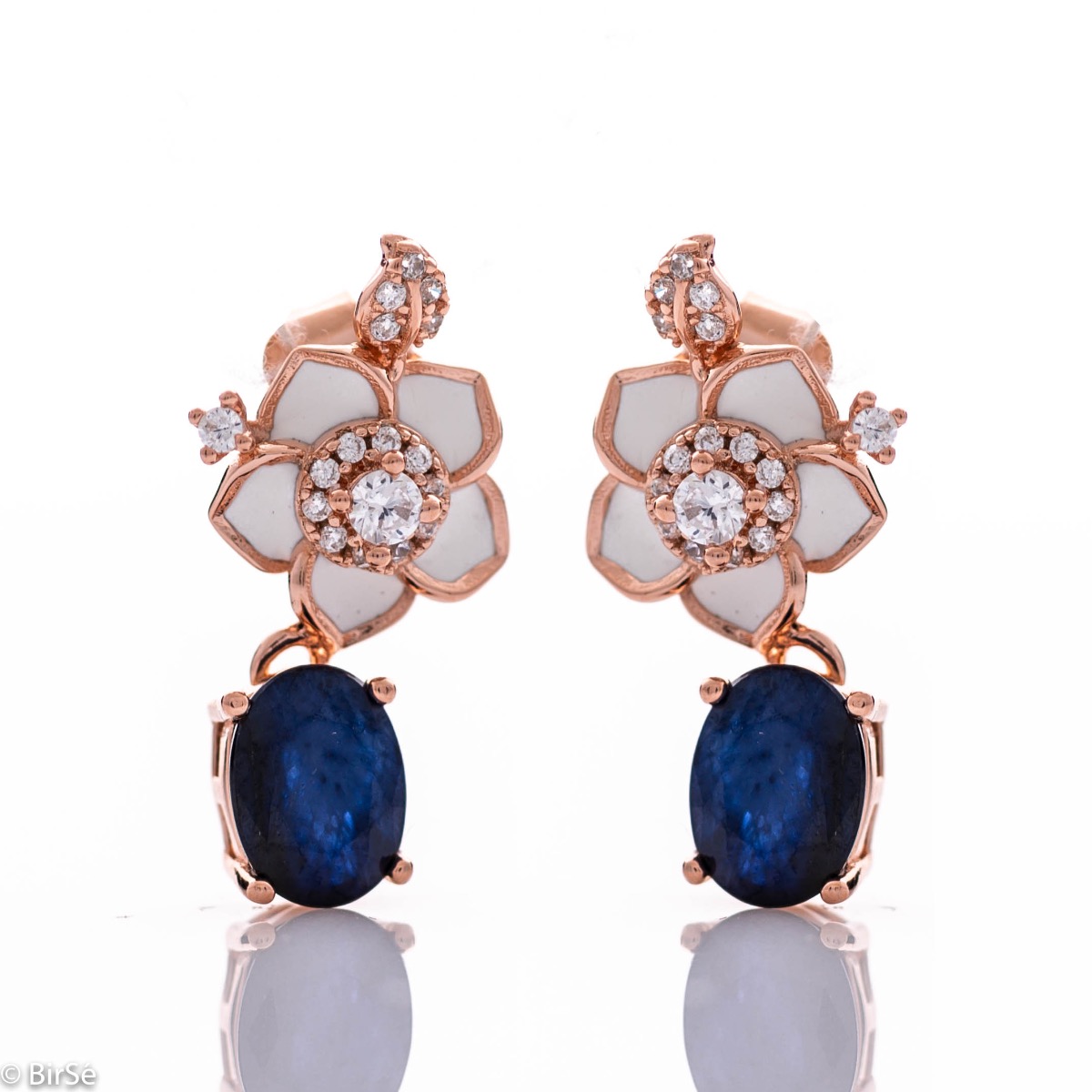 Elegant and beautiful women's earrings made of rhodium-plated rose silver, complemented by radiant natural sapphires and flowers with sparkling zircons.