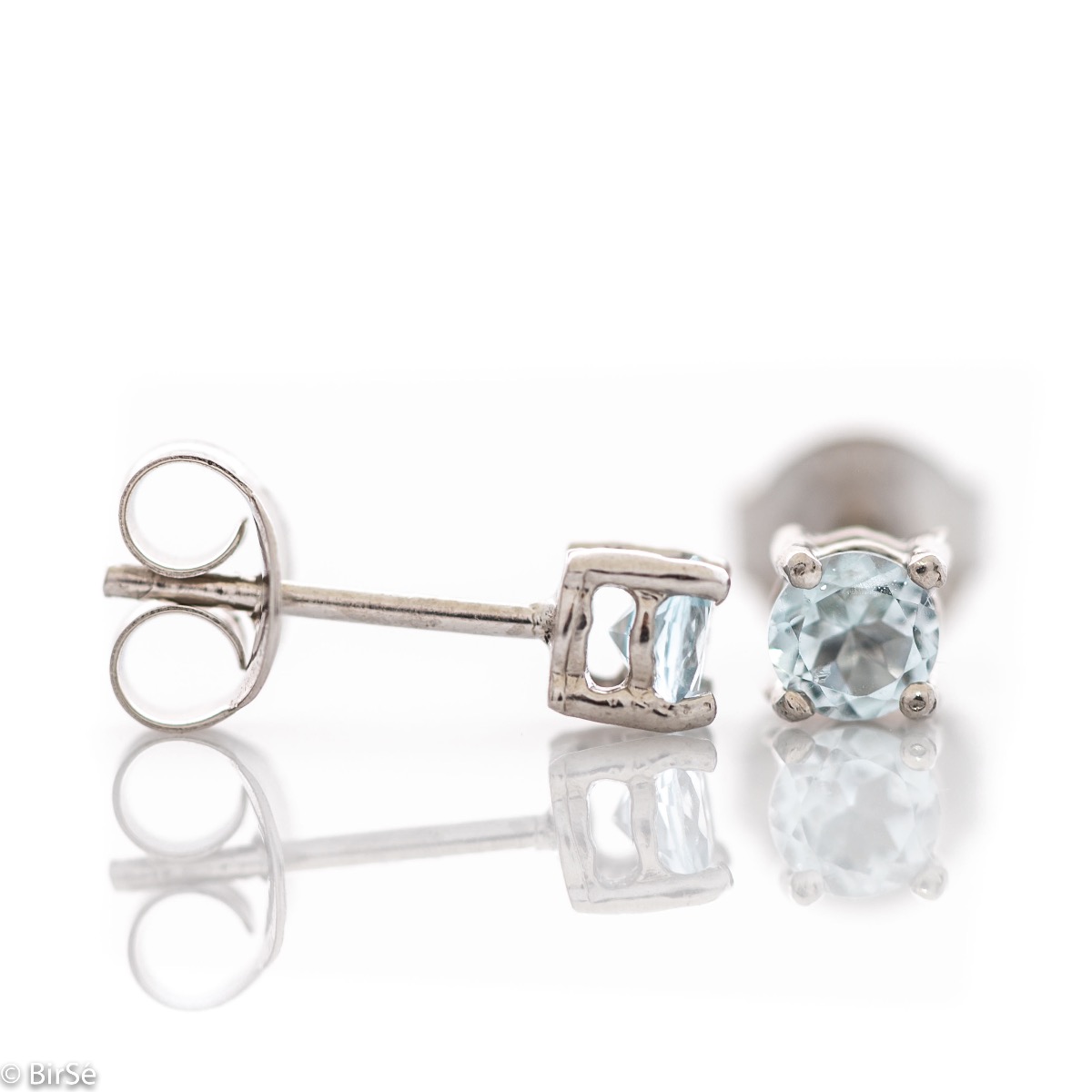 Fine stud earrings with a soft glow of natural blue topaz and beautiful craftsmanship in all rhodium silver. Light weight, suitable for both ladies and children.