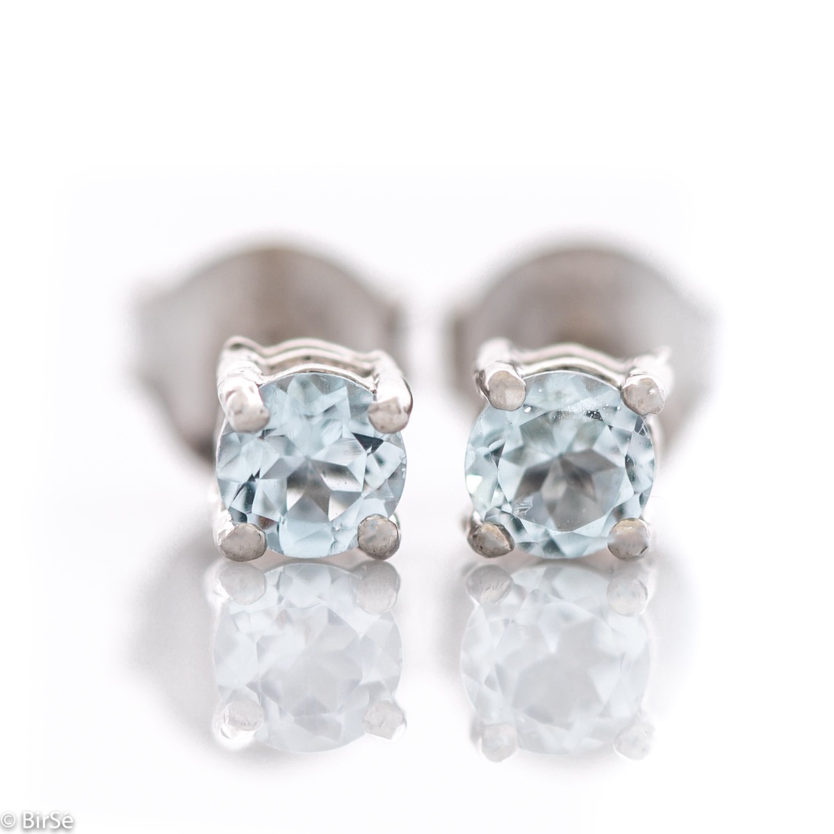 Fine stud earrings with a soft glow of natural blue topaz and beautiful craftsmanship in all rhodium silver. Light weight, suitable for both ladies and children.