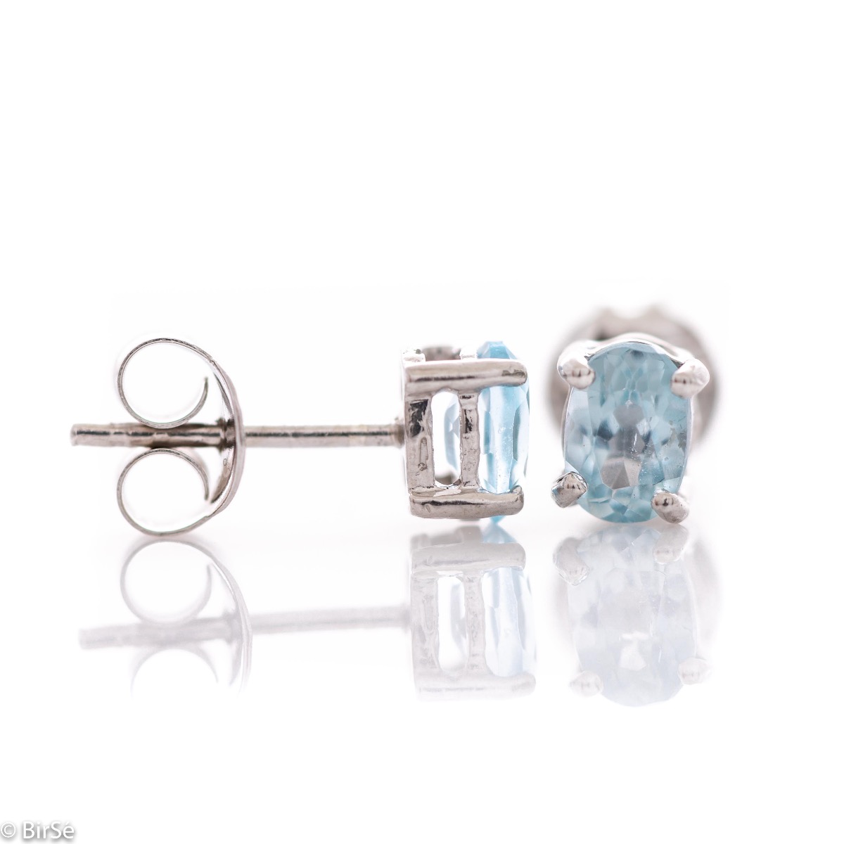 The soft blue glow of a beautiful blue topaz natural stone, combined with fine craftsmanship in all rhodium silver, in our new women's stud earrings.