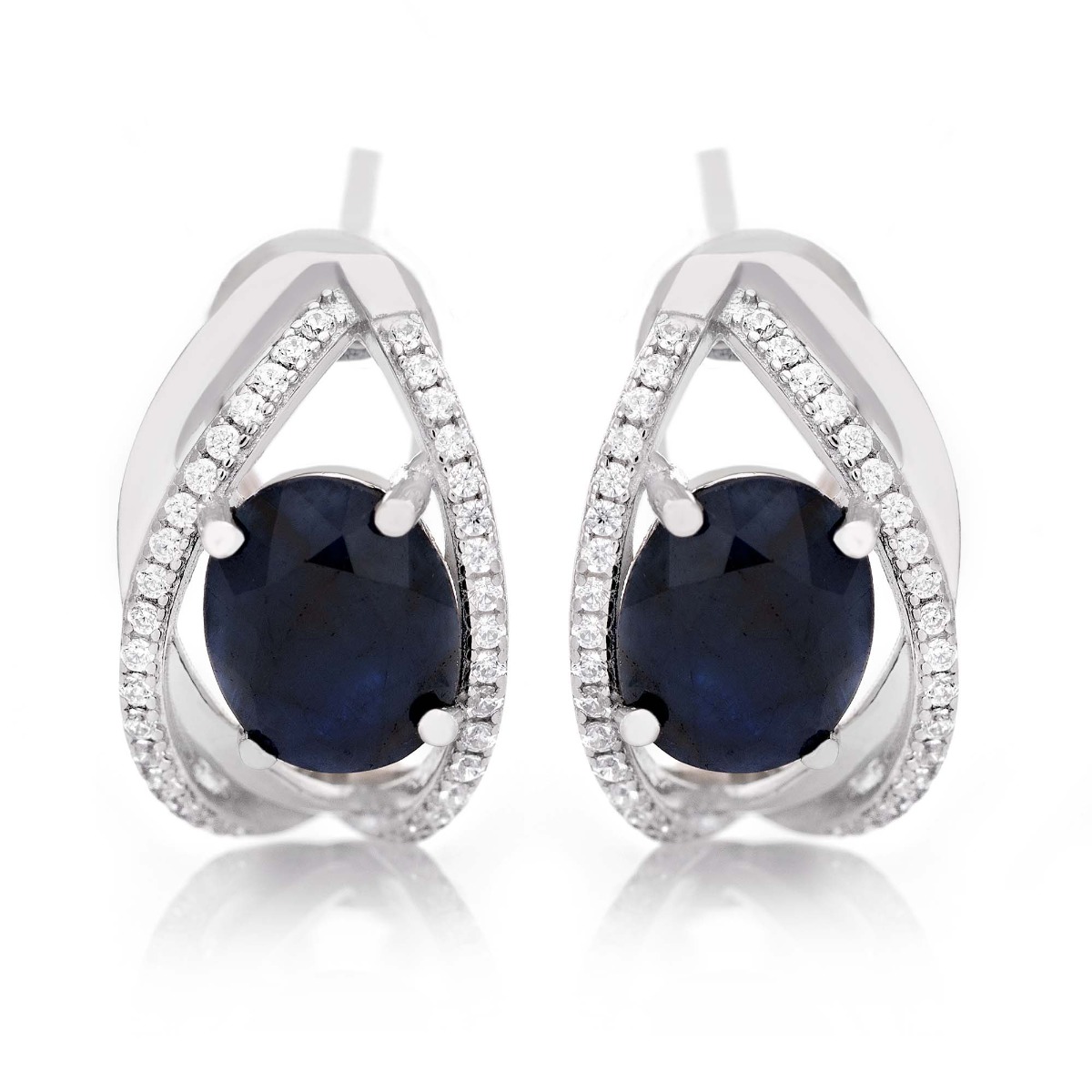 Stylish women's earrings with English clasp and a delicate combination of beautiful rhodium silver with a charming natural sapphire stone, in an exquisite oval shape, complemented by the sparkle of zircons.