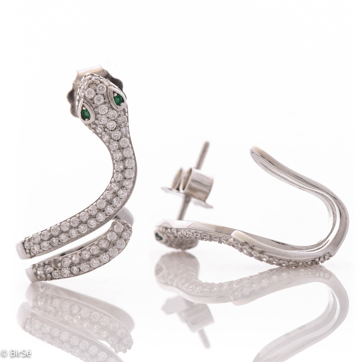 Exotic - extravagant women's earrings in the shape of a snake. Made entirely of rhodium-plated silver, with a comfortable pin fastening and covered with sparkling zircons.