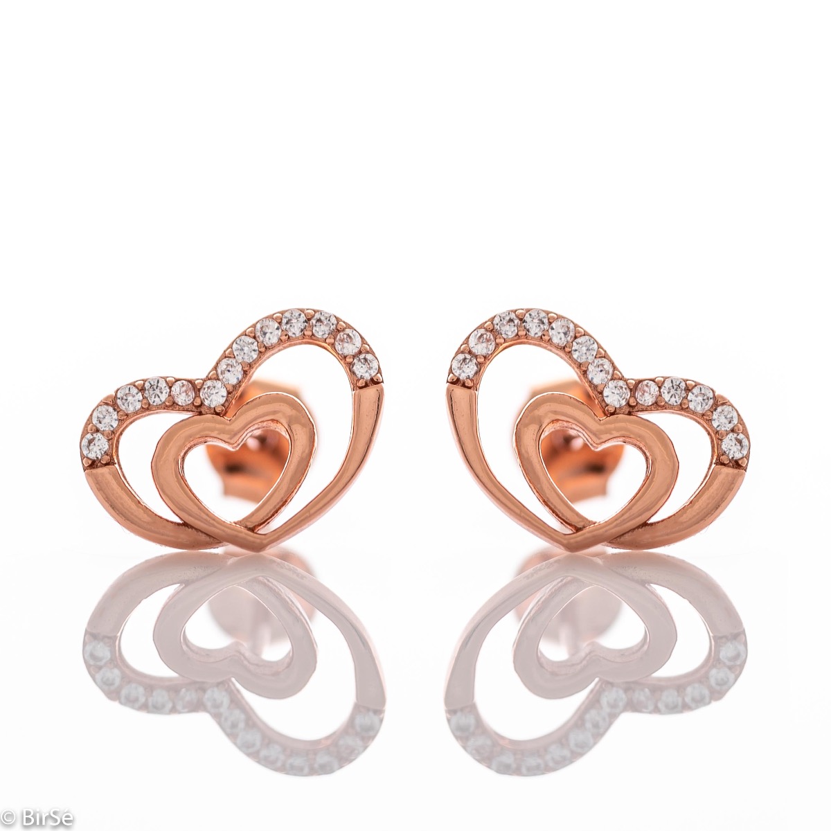 Delicate women's stud earrings with an exquisite shape and precise craftsmanship, combining two intertwined beautiful hearts with rhodium-plated rose silver and sparkling zircons. They can be combined with a pendant of the same model.