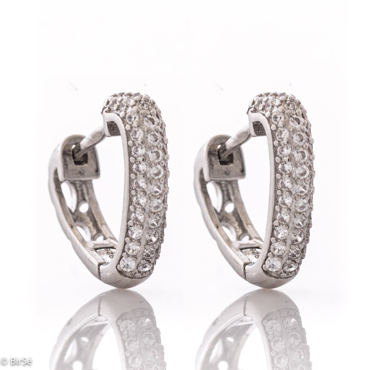 Elegant sterling silver earrings with an English clasp and precision craftsmanship entirely from soft rhodium-plated silver combined with fine, sparkling zircons.