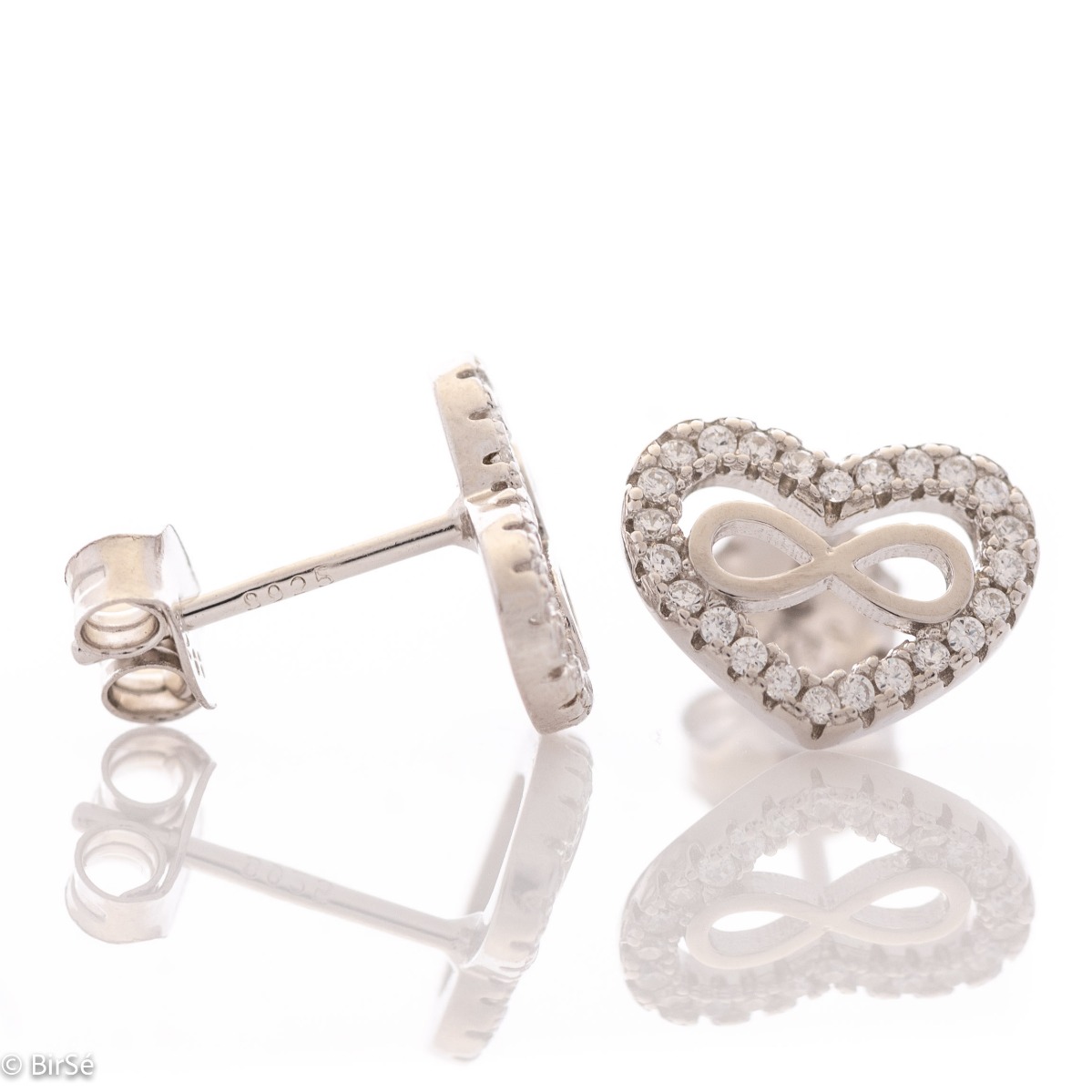 Captivating women's infinity heart earrings. They are made entirely of rhodium-plated silver and have a convenient pin fastening. They can be combined with a pendant of the same model. Encrusted with sparkling zircons, these earrings make a wonderful gift