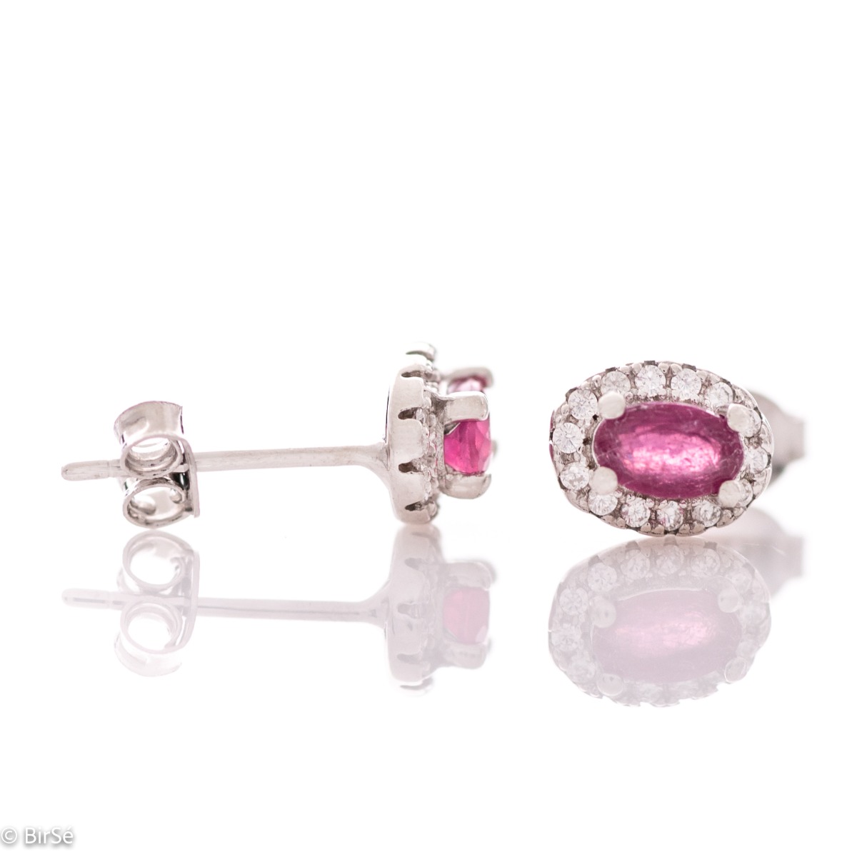 Stylish women's earrings with an elegantly shaped pattern of rhodium-plated silver and a natural ruby ​​stone, beautifully surrounded by dazzling zircons.