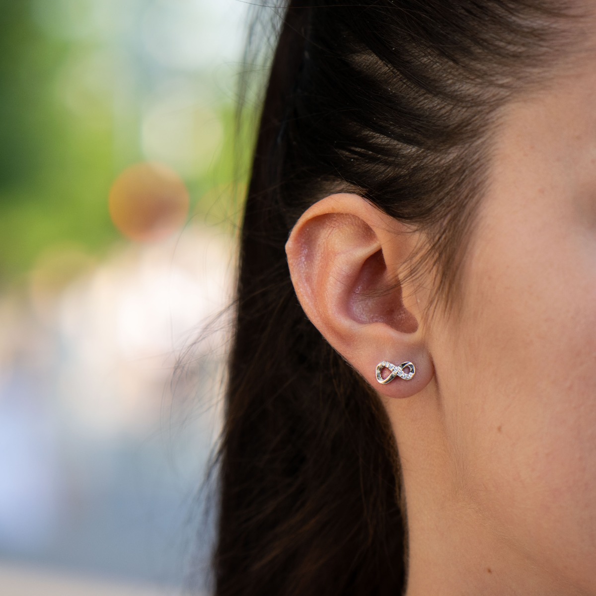 Captivating women's earrings with a spectacular shape and modern infinity design. Made entirely of rhodium-plated silver with added sparkling zircons, they are a wonderful gift for your beloved woman's everyday outfit and wonderful mood.