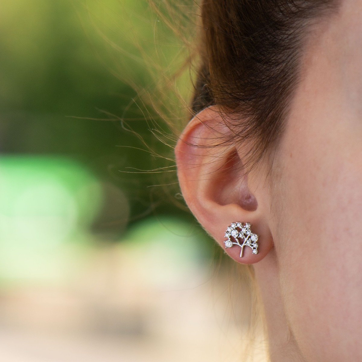 Extremely exquisite ladies' earrings with a designer shaped Tree of Life. The workmanship is entirely of fine rhodium silver, and the added sparkling zircons add even more charm to the jewelry. The fastening is with a pin.