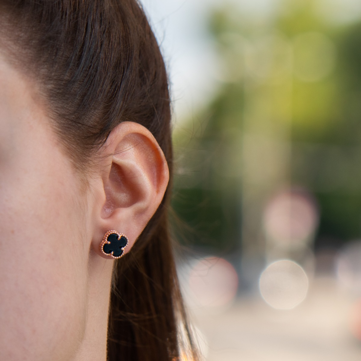 Extremely elegant women's floral style earrings made of rose silver and mystical onyx. The clasp is studded for added convenience, and these earrings will make you feel special.