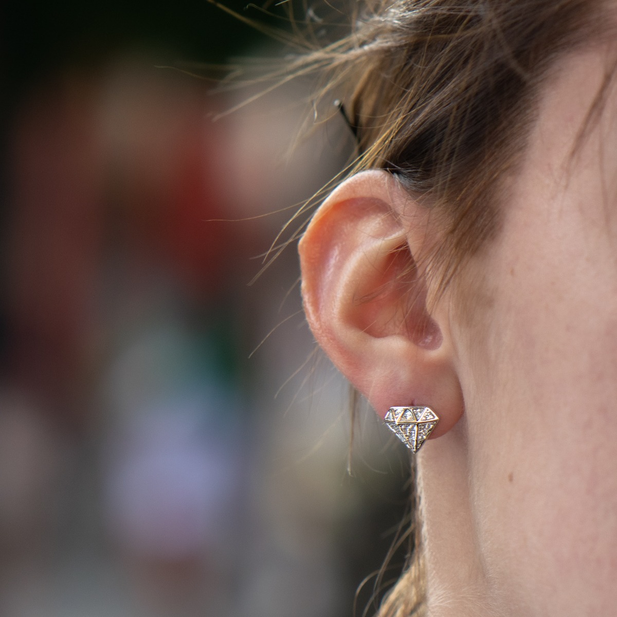 Stylish women's earrings with a modern diamond design, made entirely of soft rhodium silver and sparkling zircons, with a convenient pin fastening for your everyday life. A suitable gift for any occasion.